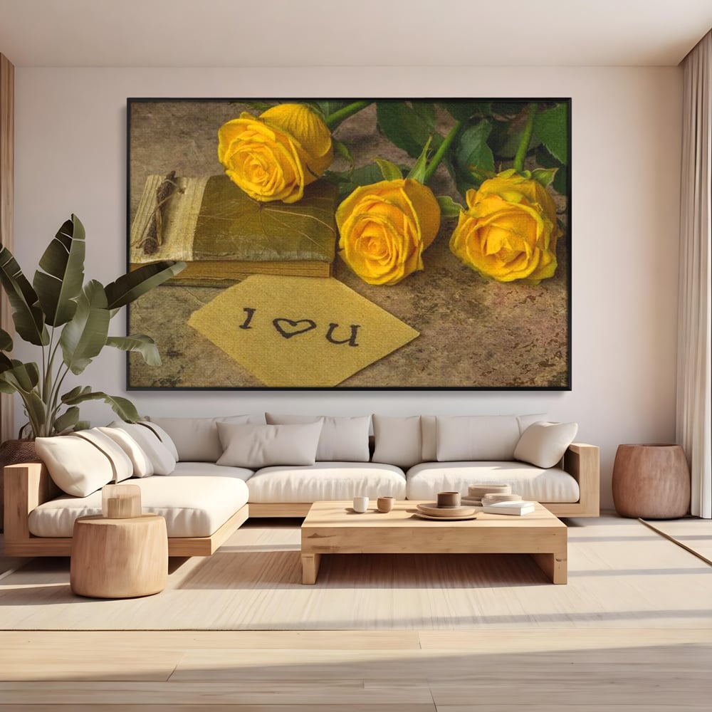 Tablou canvas cu tablou canvas cu trandafiri galbeni si jurnal, in rama de aluminiu negru, pe perete intr-un living